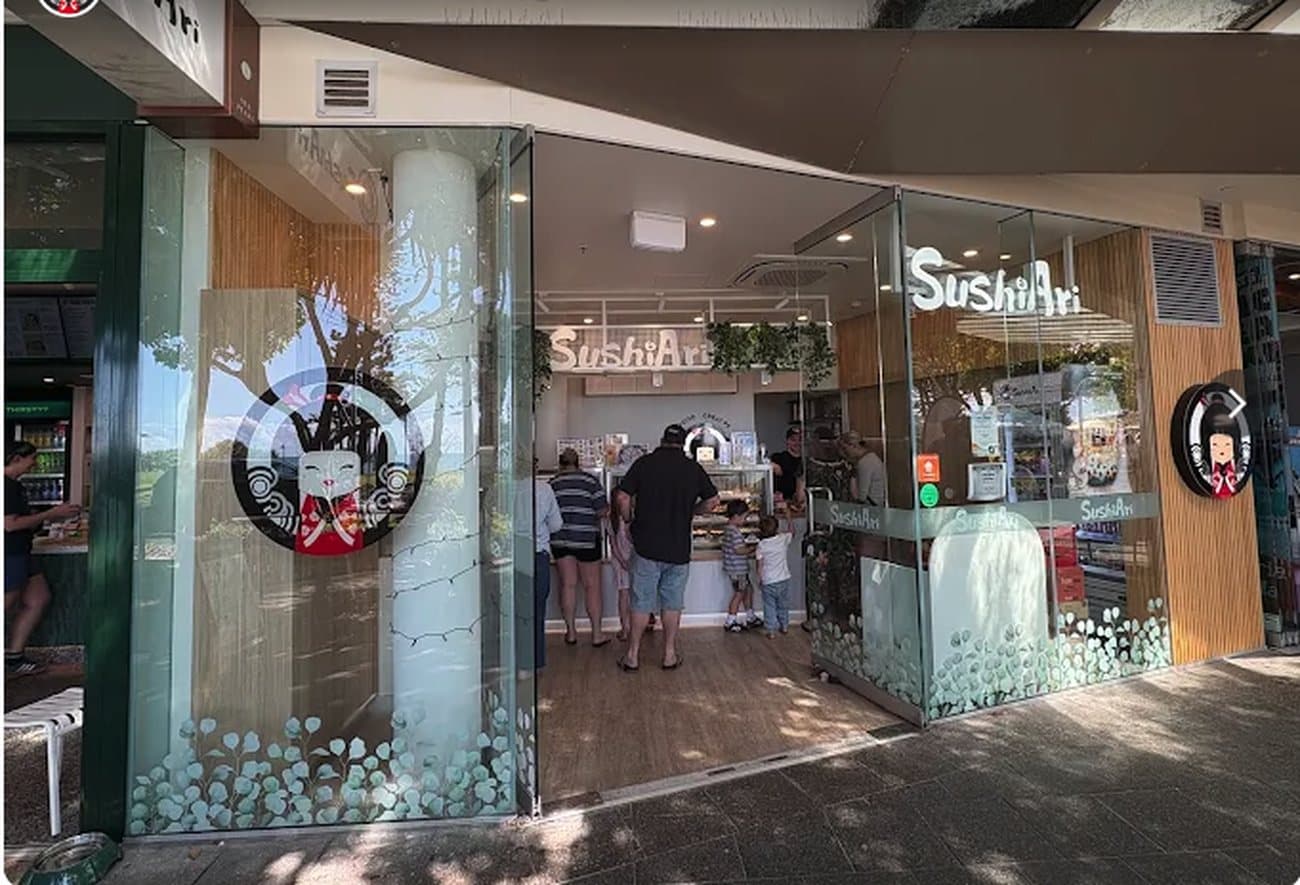 Customers at the counter of Sushi Ari in Mooloolaba, one of our family's venues